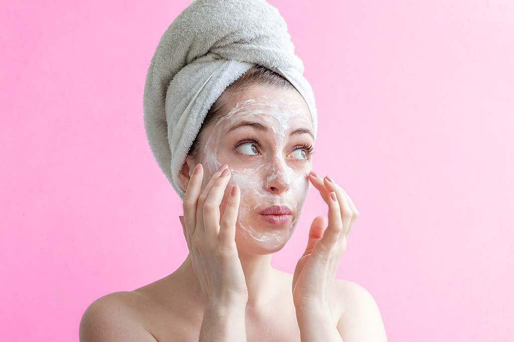 Woman applying beauty face mask | Avoid These Three Common Mask Mistakes
