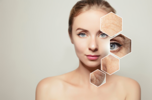 A brown-skinned lady looking in a bathroom mirror applies a clay mask, showing the benefits of skin cycling